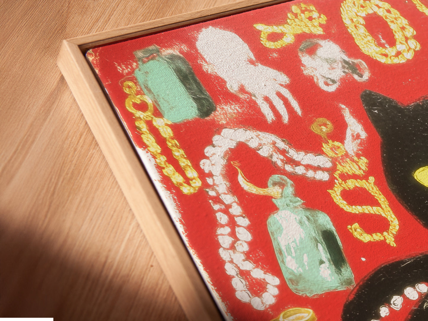 A close-up angled view of a canvas print in a floating frame. The black cat octopus artwork looks modern. The floating frame adds sophistication. This is a unique wall decor option.