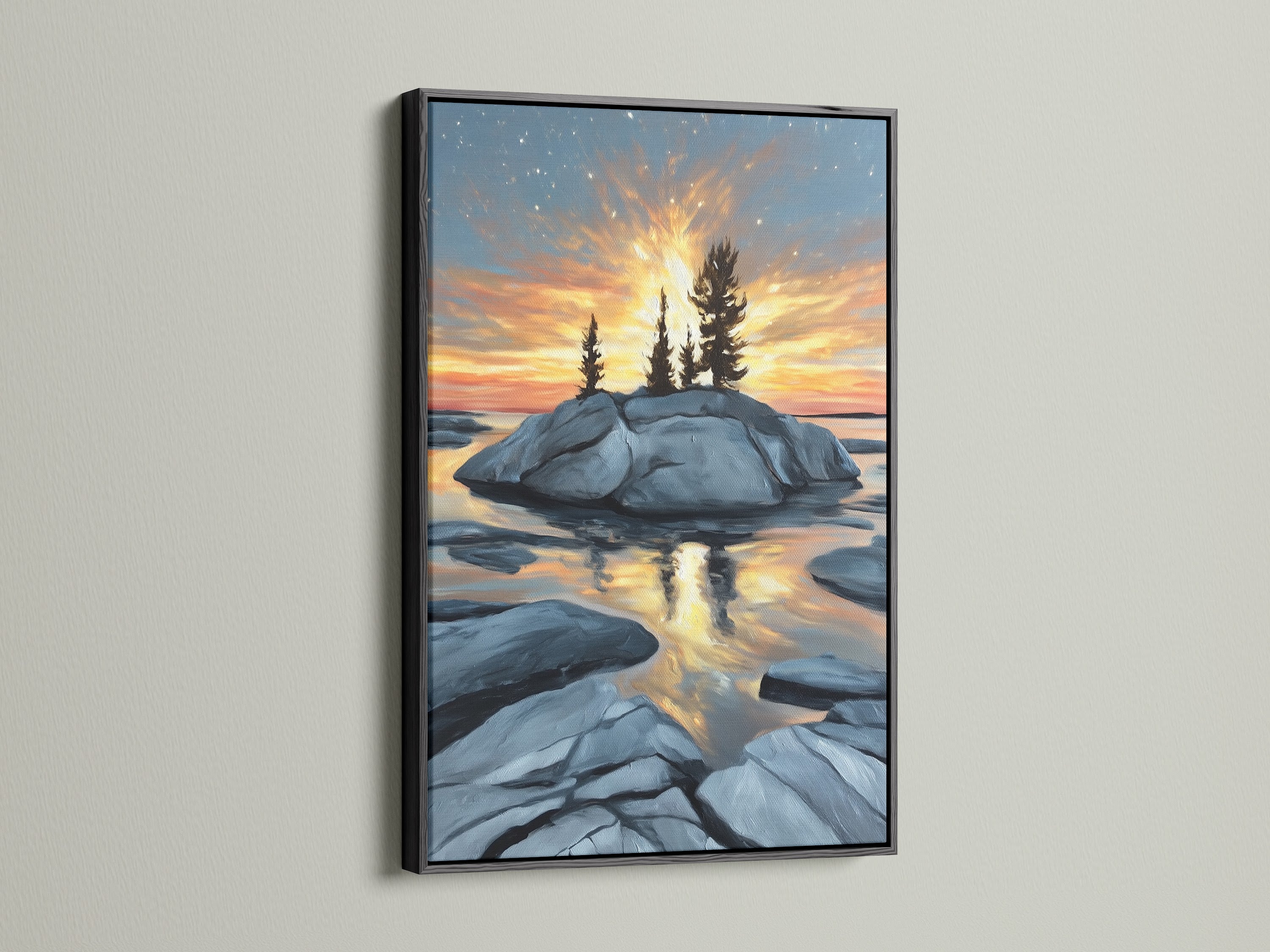 Black frame showcasing a coastal sunset artwork. This island rock wall art captures a golden hour seascape. Ideal for homeowners and lodge owners seeking rustic or nature-inspired styles. Perfect for vacation rentals