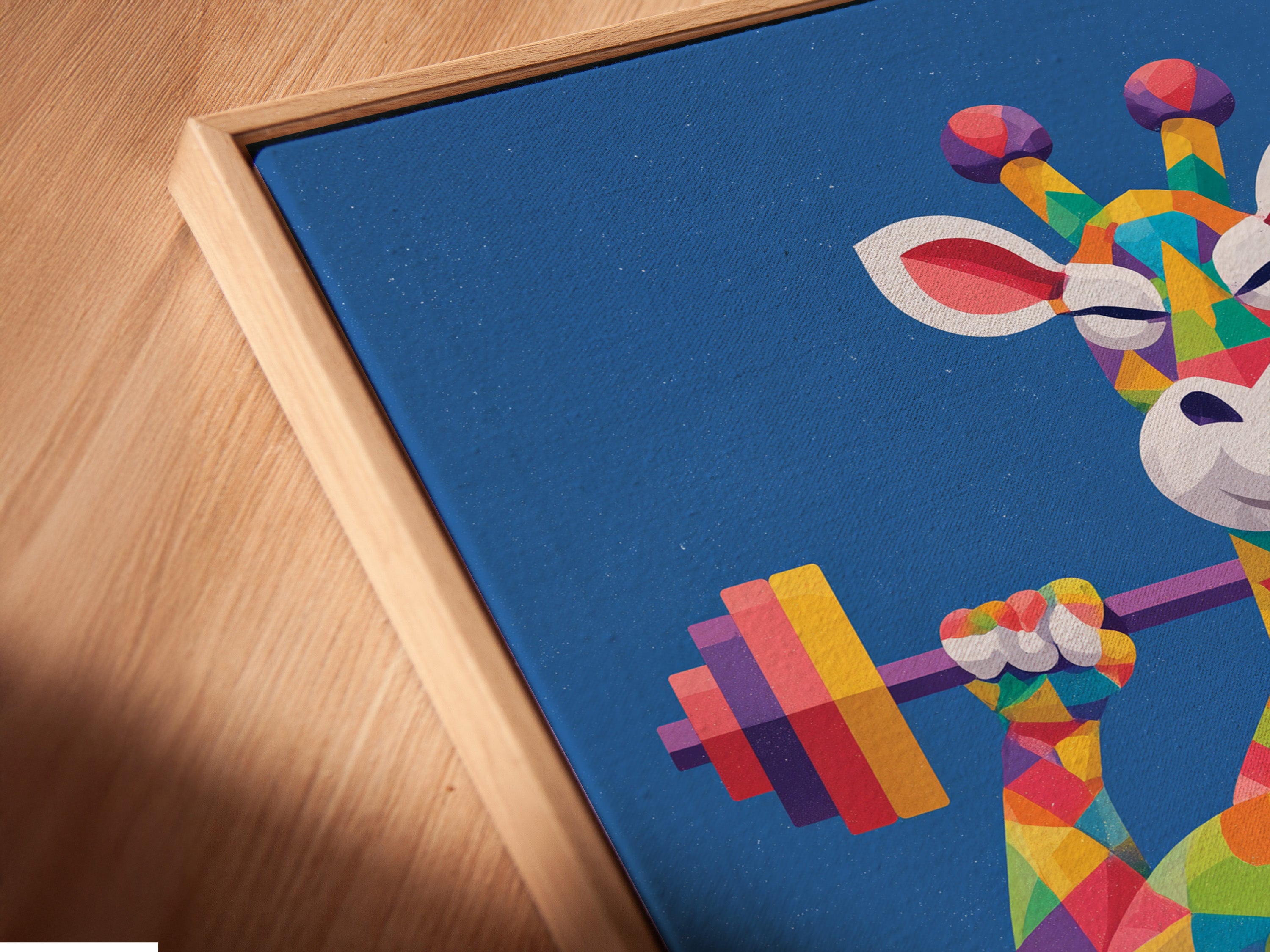 Close up of Geometric Giraffe canvas print in a floating frame. The artwork showcases a colorful animal lifting weights. Enhance your gym with this modern art. The primary color is blue with rainbow accents. Get inspired with this motivational piece.