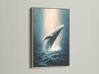 This is a whale canvas print with an oak frame. It is an ocean wildlife wall art featuring a humpback whale. It is marine life art. The whale artwork is perfect for coastal wall decor. This is sea life print.