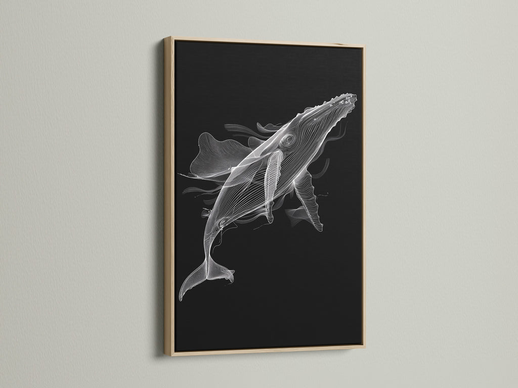 A close up of a black and white whale artwork in an oak frame. The minimalist ocean canvas print enhances modern bedroom decor. Discover the beauty of marine life art. The oak frame provides a natural touch. This whale canvas print is perfect for coastal wall decor.