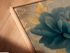 A close-up angled view of a canvas print in a floating frame. The art depicts a blue flower. The floating frame adds a modern touch. The canvas print is stretched and ready to hang.