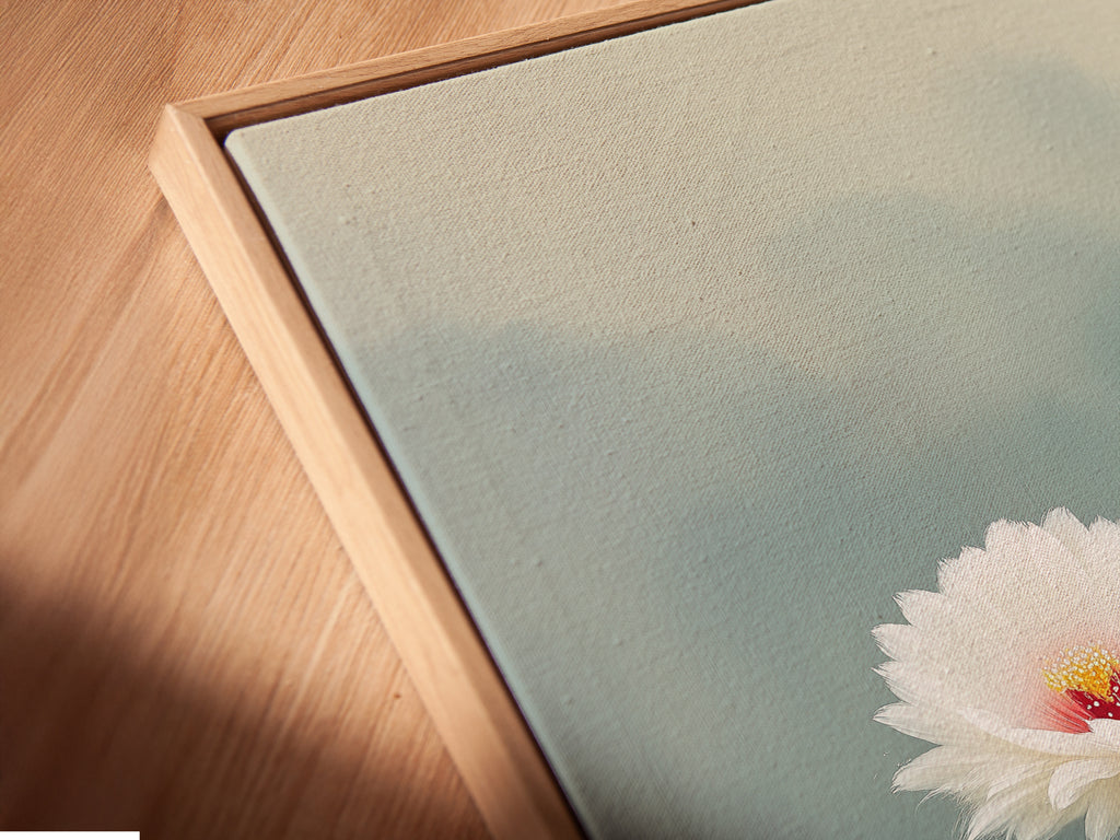 Angled close up of a canvas print in a floating frame. The Cactus Flower artwork is beautifully presented. This botanical print is perfect for bedroom wall decor. The desert bloom adds a modern touch. A unique floral canvas for any room.