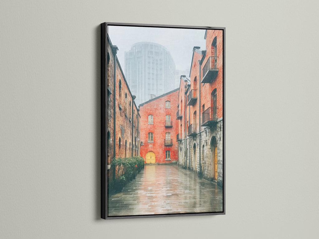 The black frame provides a striking contrast to the Brick Building Canvas Print. The urban landscape artwork is suited for minimalist and urban spaces. It is a great choice for homeowners renters and business owners.