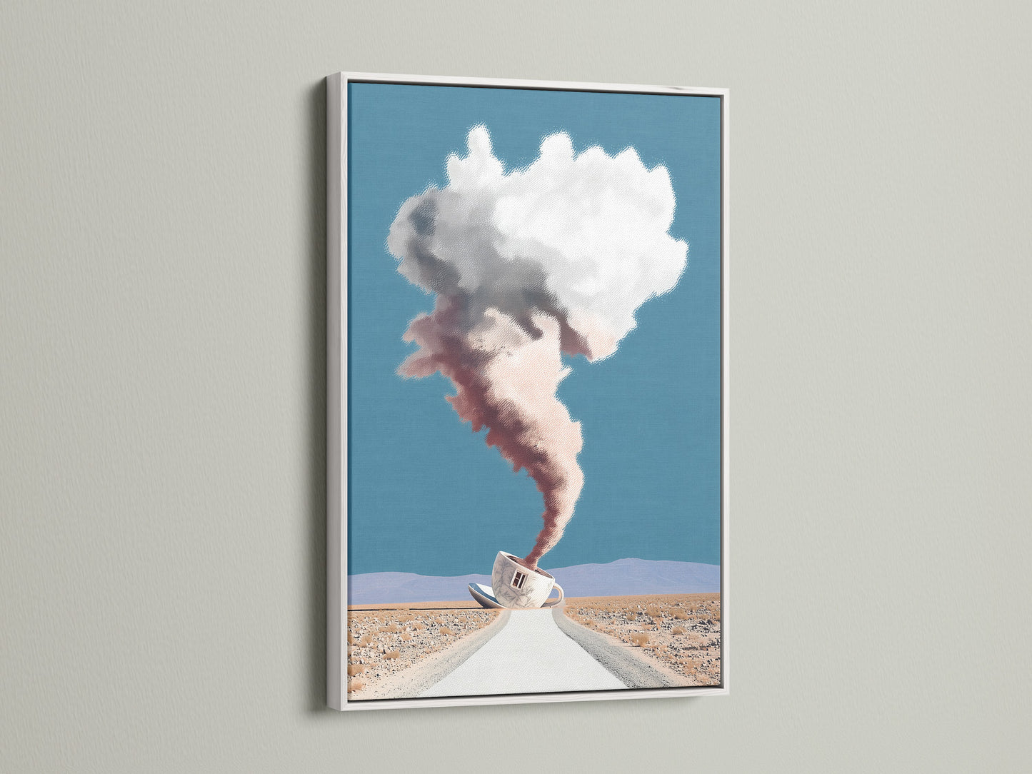 Surreal Coffee Cup Artwork in a White Frame. This desert landscape wall art has a dreamy cloudscape. Ideal for modern office decor. The white frame accentuates this unique artwork. A fine art print perfect for homeowners and interior designers.