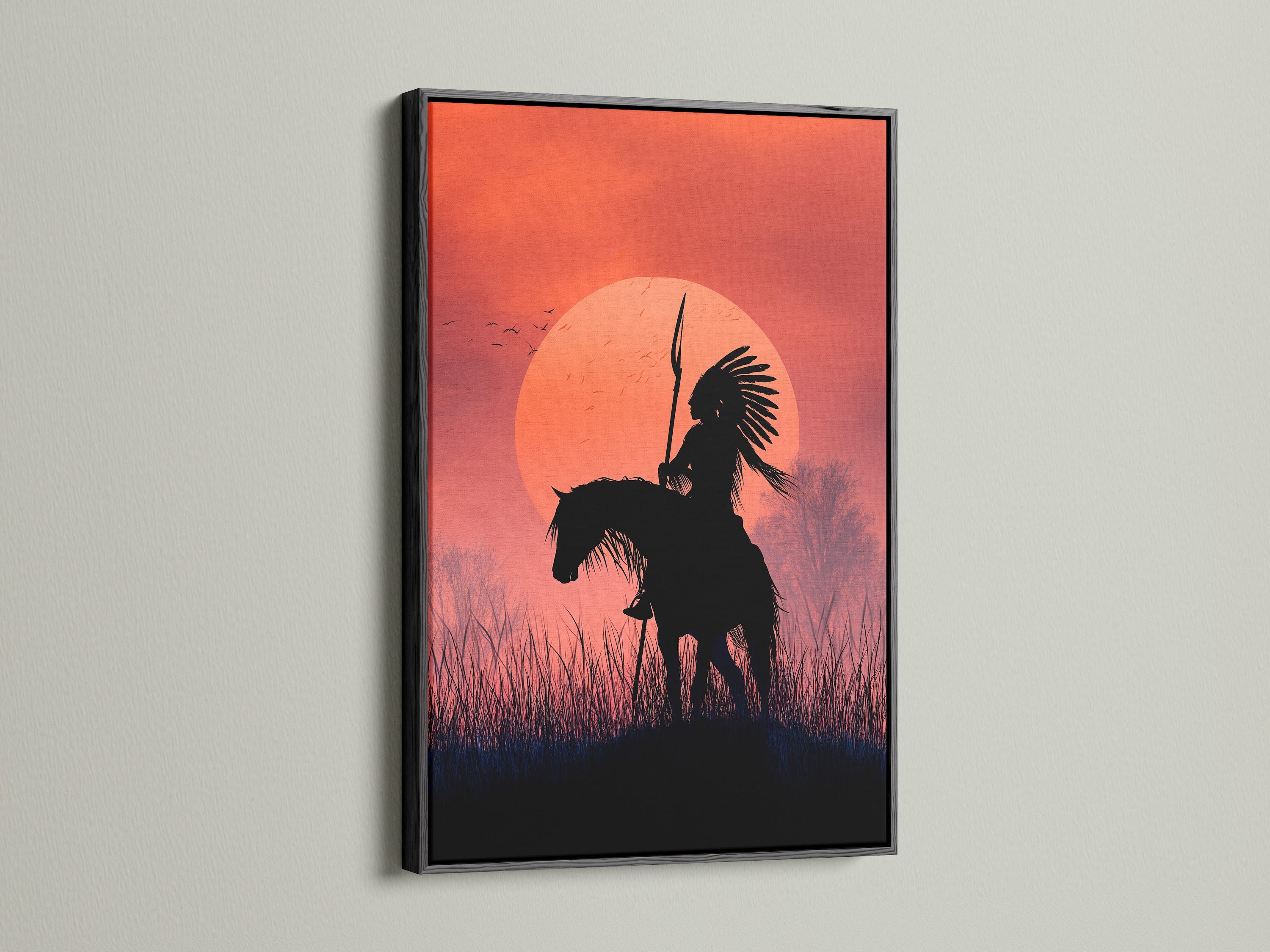 Native American Warrior canvas art in a black frame. This silhouette print captures the essence of western art. Enhance your decor with this tribal wall art featuring a horseback rider against a sunset. Perfect for southwestern-inspired spaces.
