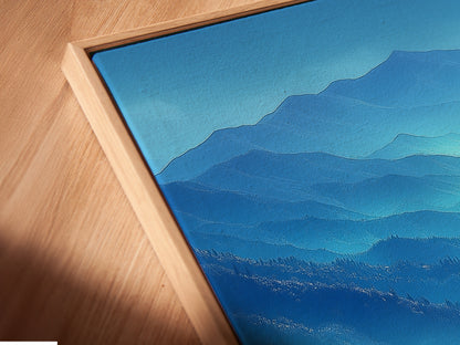 Get a close-up of a canvas print in a floating frame. The angled view showcases the artwork's detail. This modern artwork enhances any wall. Perfect for adding a touch of nature. Experience the calming presence of the Blue Ridge Mountains.