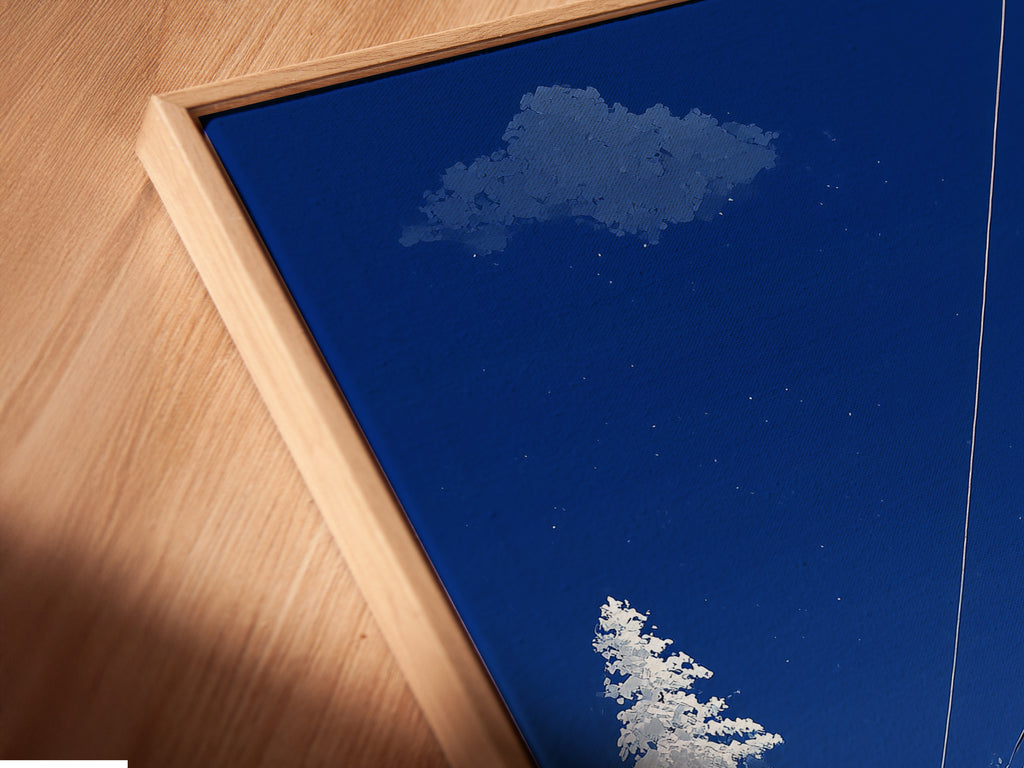 Close-up of a canvas print in a floating frame. The ski lift artwork features a winter mountain scene. The alpine cable car adds a touch of adventure. This piece is perfect for cabin decor. The floating frame gives the art a modern and stylish look. It enhances the snowy landscape.