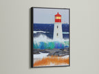Lighthouse artwork with a black frame. This seascape canvas adds sophistication to your decor. The black frame creates a striking contrast. It's perfect nautical decor for a beach house or office space.
