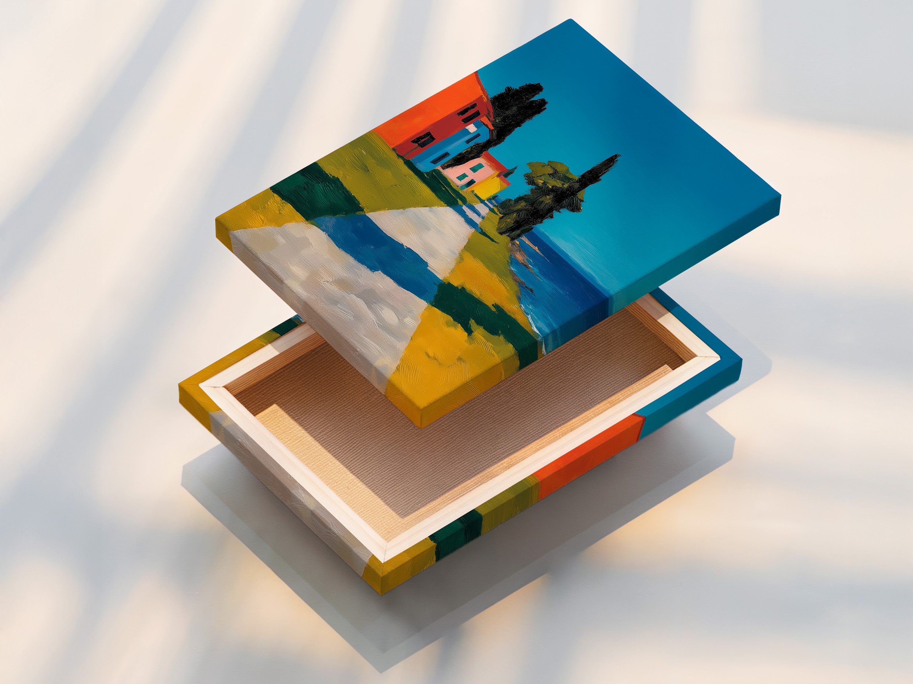 Stretched canvas print is displayed. The art features a path leading to colorful buildings. It is a coastal scene under a bright sky. The stretched canvas offers a ready to hang artwork. It brings texture and depth to the art.