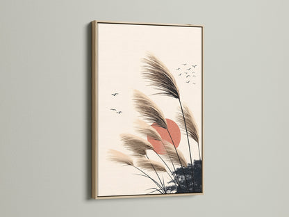Pampas Grass artwork in an oak frame. This minimalist nature artwork adds a touch of bohemian elegance. Ideal for bedroom wall decor or living room art. The sunset canvas features neutral colors. This makes it a versatile piece for any home. Perfect for interior stylists seeking scandi art.