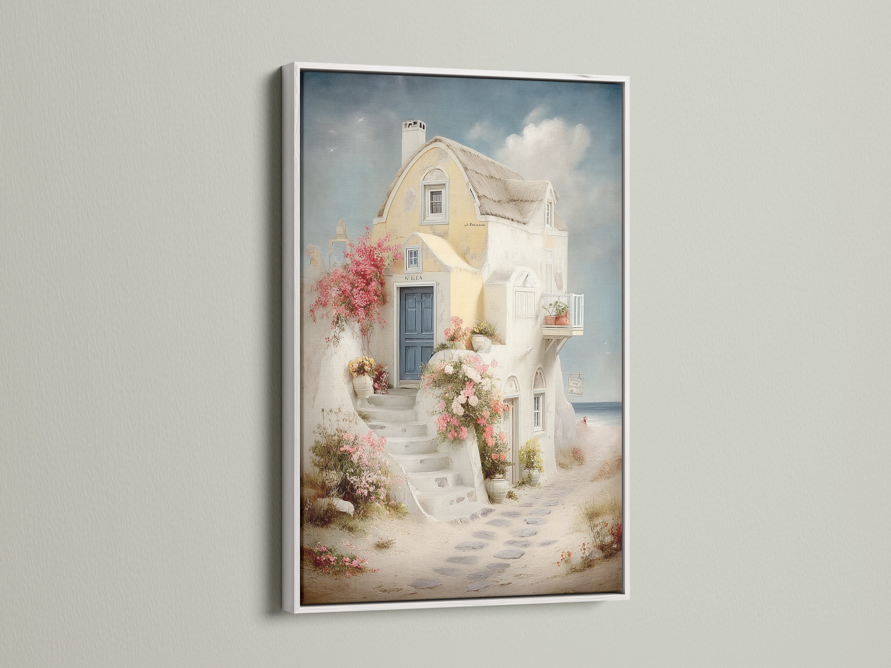 Coastal artwork with a white frame. The artwork captures a Mediterranean house canvas with a blue door. This Santorini art piece is ideal for vacation home decor. Enhance your bedroom wall art with this stunning sea view print.