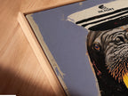 Close up of a canvas print in a floating frame. The artwork features a walrus captain. This quirky animal art enhances your coastal decor. Perfect for adding a whimsical touch to any space. A great piece for nautical wall art.