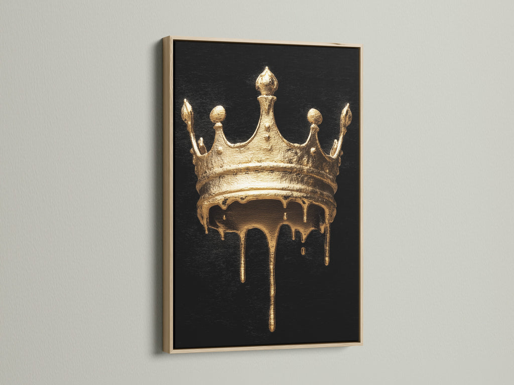 Melting Crown artwork with an oak frame. The artwork features a gold melting crown on a black background. This gothic wall art will add a touch of luxury to your home. Perfect for living rooms bedrooms and offices.