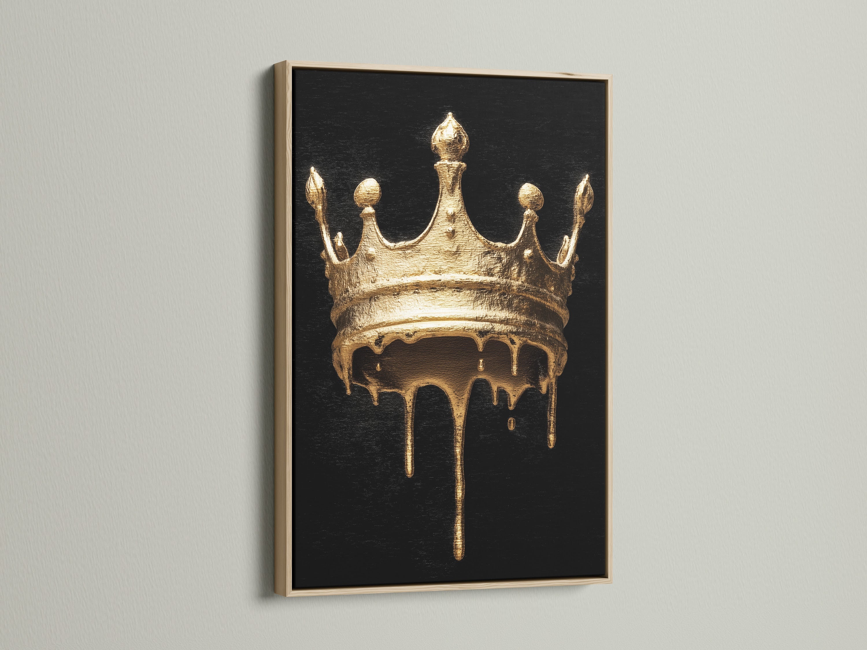Melting Crown artwork with an oak frame. The artwork features a gold melting crown on a black background. This gothic wall art will add a touch of luxury to your home. Perfect for living rooms bedrooms and offices.