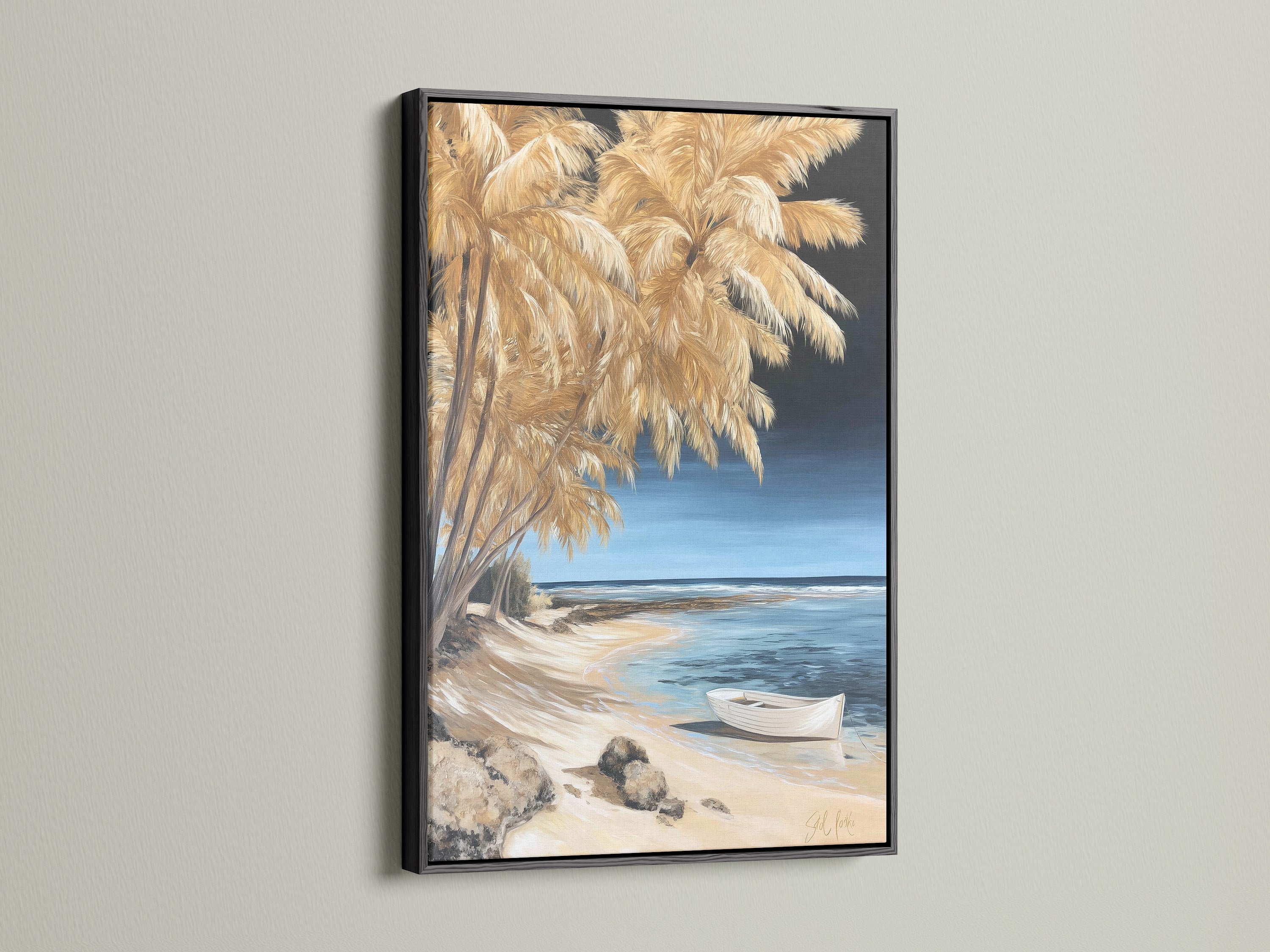 Coastal beach canvas artwork is displayed in a black frame. This boat art print offers a bold statement. The black frame contrasts nicely with the neutral tone decor.