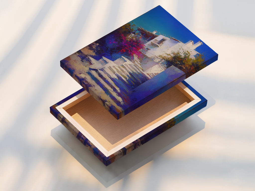 A stretched canvas print featuring Mediterranean Village artwork. The Greek Island staircase print is ready to hang. This coastal wall decor brings beauty to any room. The blue and white artwork is vivid and eye-catching.