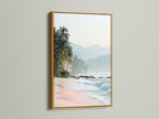 A gold frame adds elegance to this tropical beach canvas print. The artwork displays beautiful coastal scenery. Pink sand and ocean views create a tranquil atmosphere for vacation home decor.