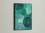 A black frame showcases emerald green abstract art. The modern geometric circle canvas print offers contemporary flair. It provides a sophisticated touch to your space. This artwork is ideal for green abstract art lovers.