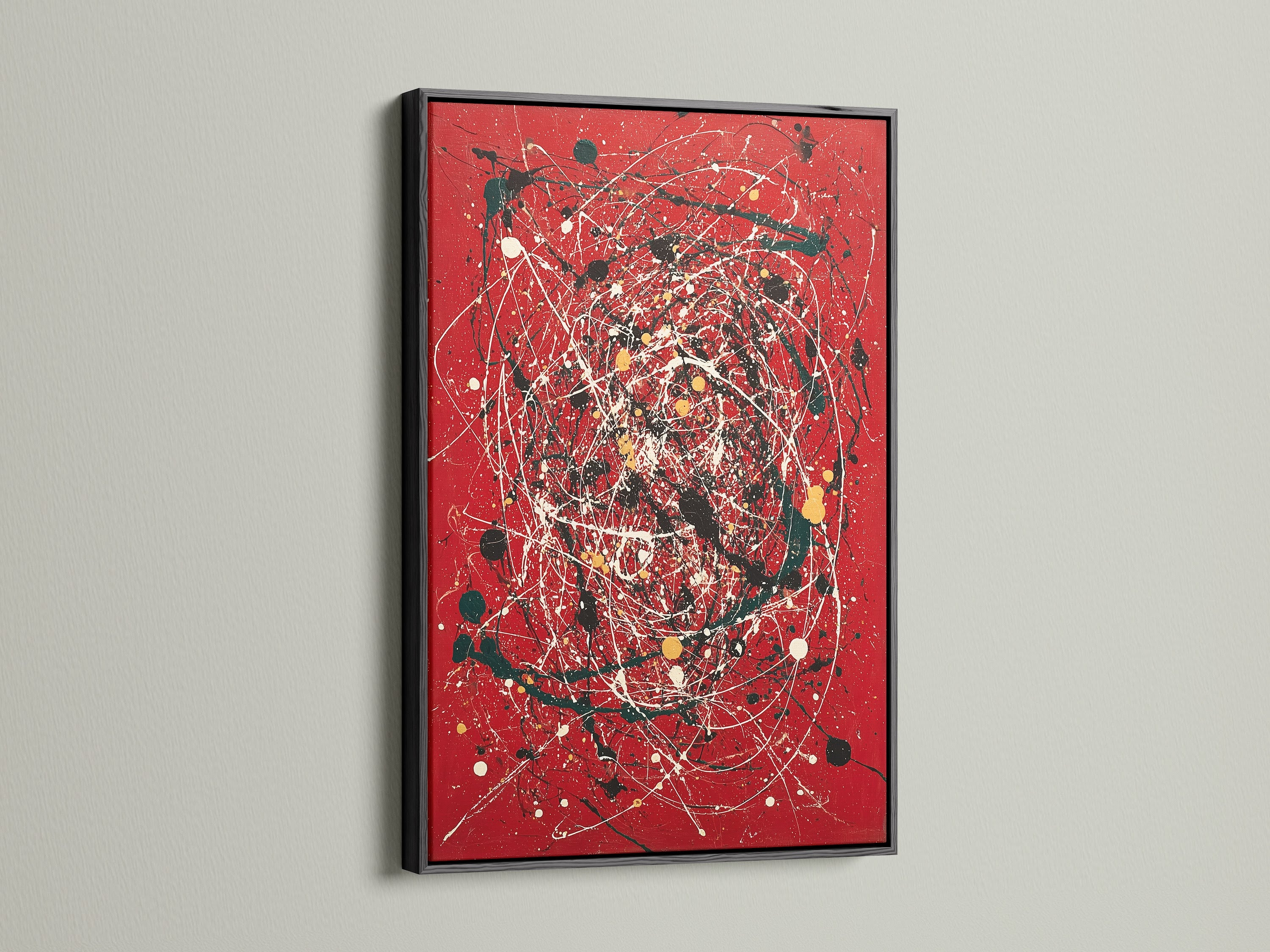 Eye-catching abstract splatter art print on a red canvas. The artwork is elegantly framed in black. The use of paint drip art adds a modern touch. Perfect for contemporary spaces. This bold red art makes a statement in any room. Ideal for modern art enthusiasts.