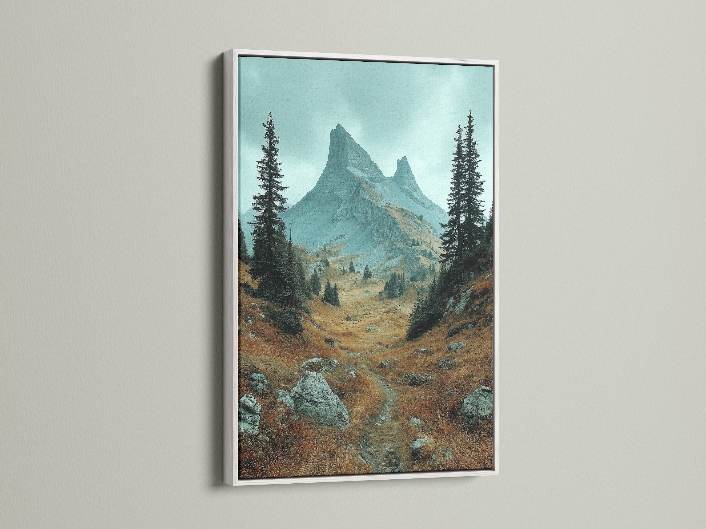 White frame mountain landscape artwork. This landscape wall art brings a serene alpine valley into your home. The white frame enhances the nature photography. It's perfect as mountain decor or earth tone wall art. The artwork adds a fresh touch to any space.
