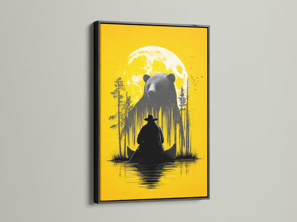 Framed Bear and Canoe artwork is displayed. The frame is a black frame. It is a rustic nature wall art. It shows a bear and a canoe under a yellow moon. Ideal for cabin decor and adventure art lovers. The black frame adds a touch of sophistication. It enhances the contrast of the artwork.