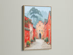 Village Street canvas print in an oak frame. The oak frame enhances the rustic charm of this vintage style art. Perfect for adding a touch of European flair to your entryway or living room.  This art brings warmth to any space.