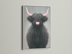 Highland Cow art with pink horns in a white frame. This cute nursery art brings a touch of Scottish charm to your home. The white frame offers a clean modern look. This animal artwork is perfect for any room.