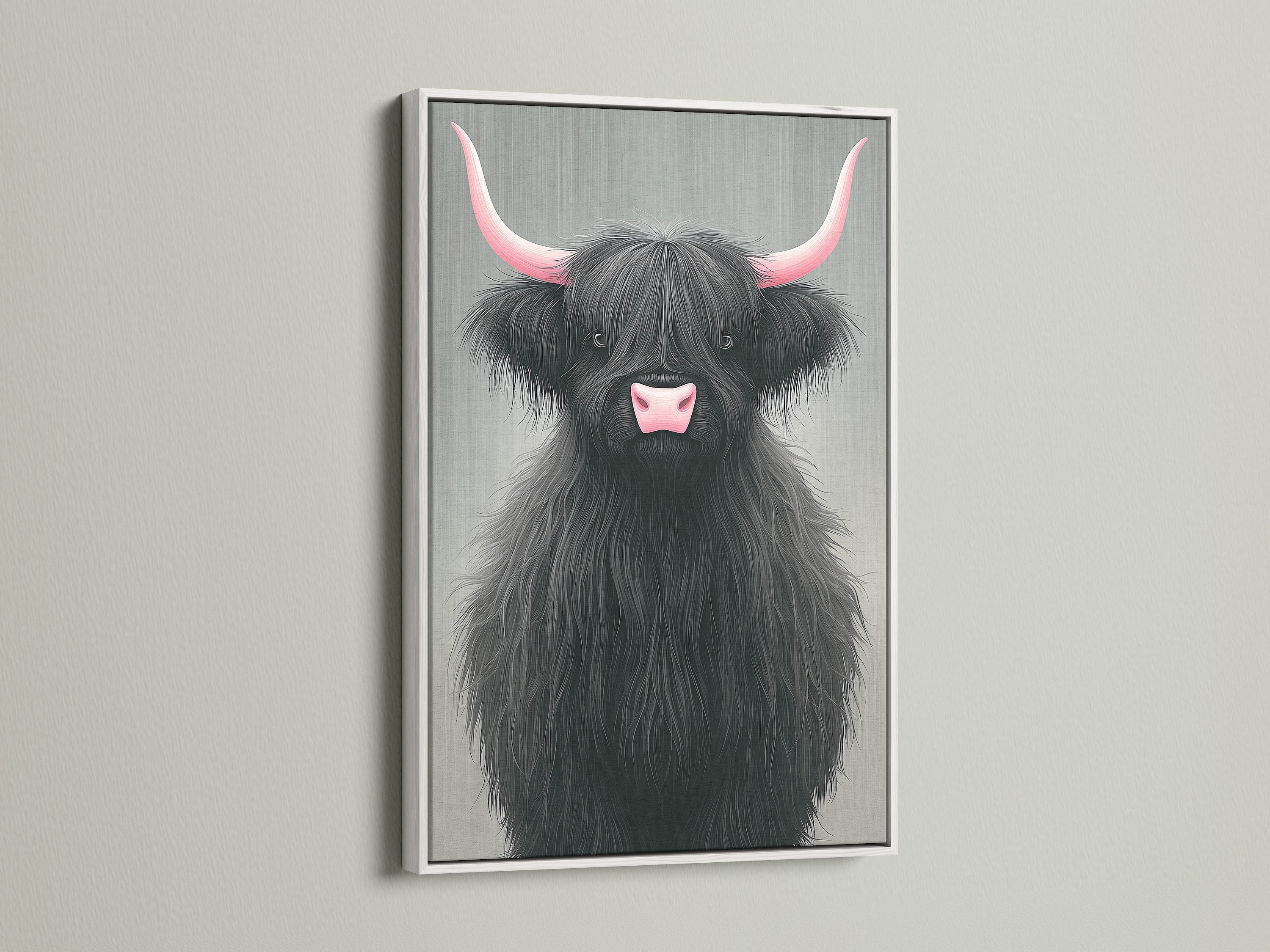 Highland Cow art with pink horns in a white frame. This cute nursery art brings a touch of Scottish charm to your home. The white frame offers a clean modern look. This animal artwork is perfect for any room.
