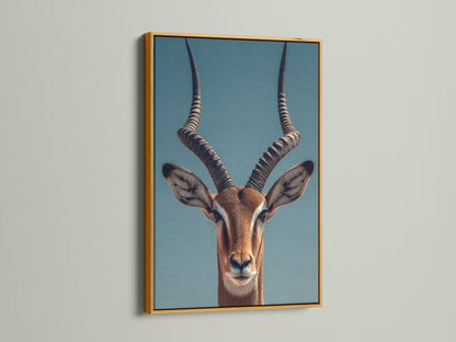An Impala art print is elegantly displayed. The print is set in a luxurious gold frame. The gold frame adds a touch of glamour. It enhances the artwork with a warm metallic hue.