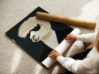 A woman carefully rolls a fine art poster paper. This highlights the quality and care in handling the Cool Llama Art Print. Fine art poster paper showcases the formal portrait art beautifully. Get your quirky animal art today.