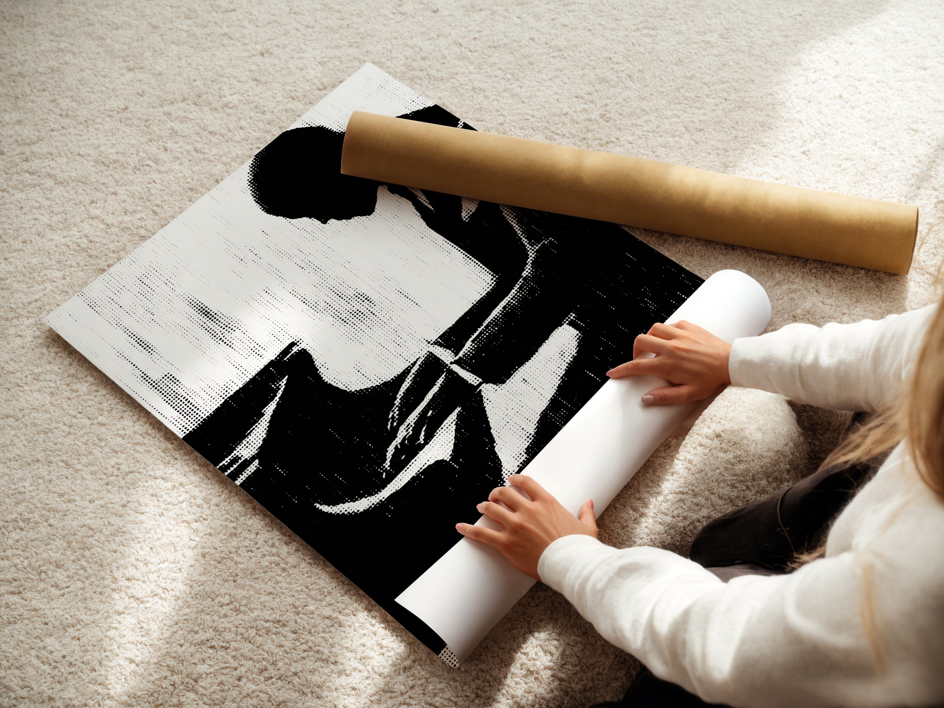 A woman is carefully rolling a fine art poster paper. The paper features a musician silhouette art print. This black and white print is perfect for jazz wall art. It's great for adding vintage music art to your space.
