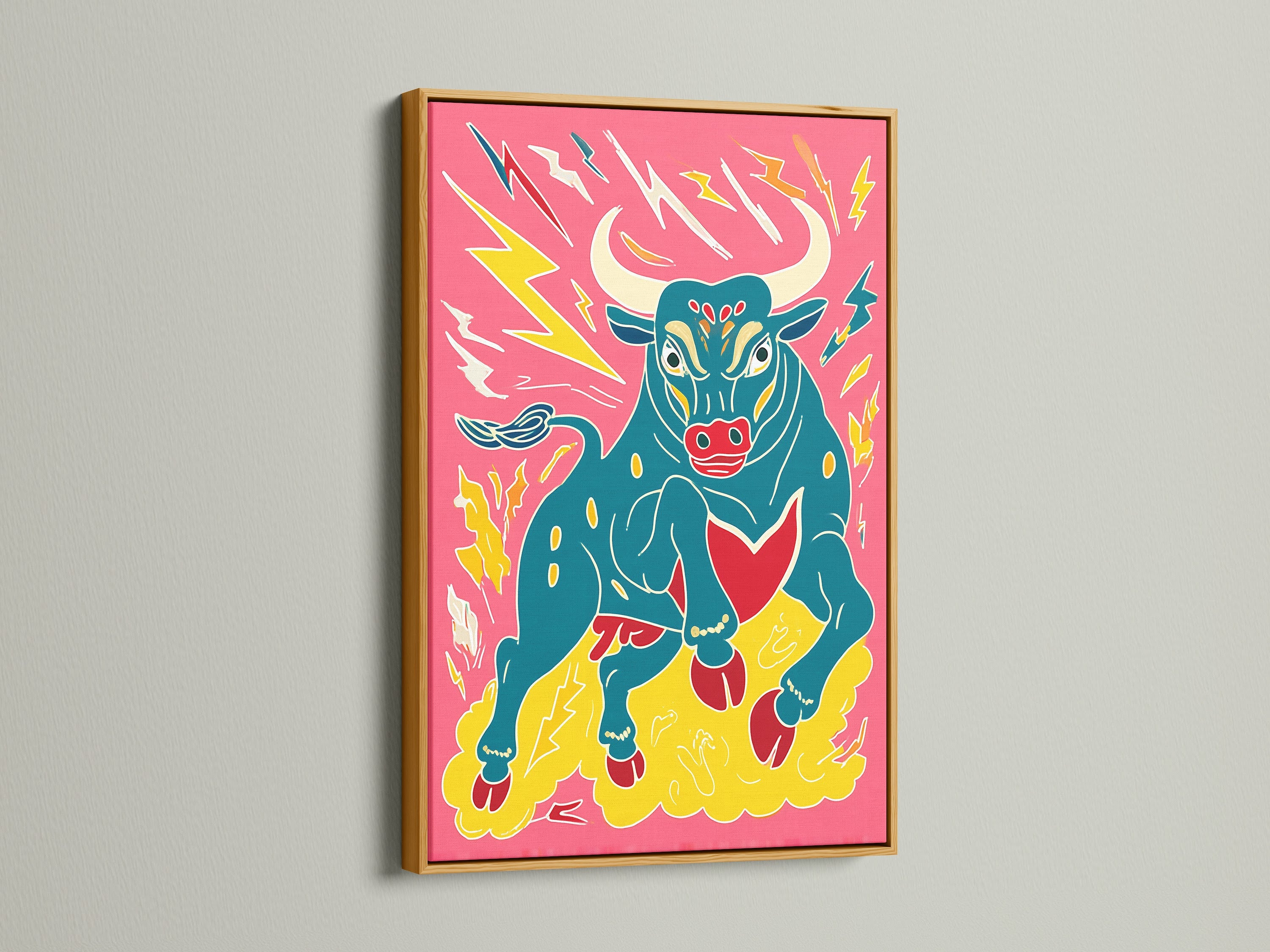 Bull artwork displayed in a gold frame. This pop art print features a colorful animal. It brings a touch of glam to any room. This maximalist art piece is bold and eye-catching. Shop this funky home decor now.
