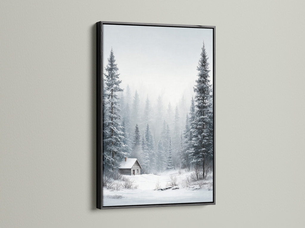Winter Forest artwork presented in a black frame. The artwork portrays snow-covered pine trees. A cozy cabin is nestled in the winter forest. This framed print adds contrast to light walls. Elevate your cabin or rustic decor.