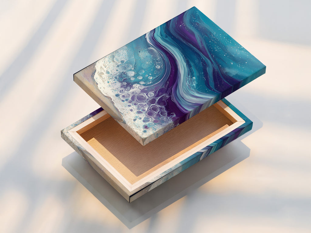 This is a stretched canvas print of ocean wave abstract artwork. The teal and purple fluid art creates a coastal vibe. Use this for bedroom decor. A modern beach artwork option.