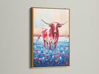 Texas Longhorn art in a gold frame. The artwork shows a red and white Longhorn standing in bluebonnets. Elevate your wall decor with this elegant western art piece. Great for adding a rustic touch to any room.