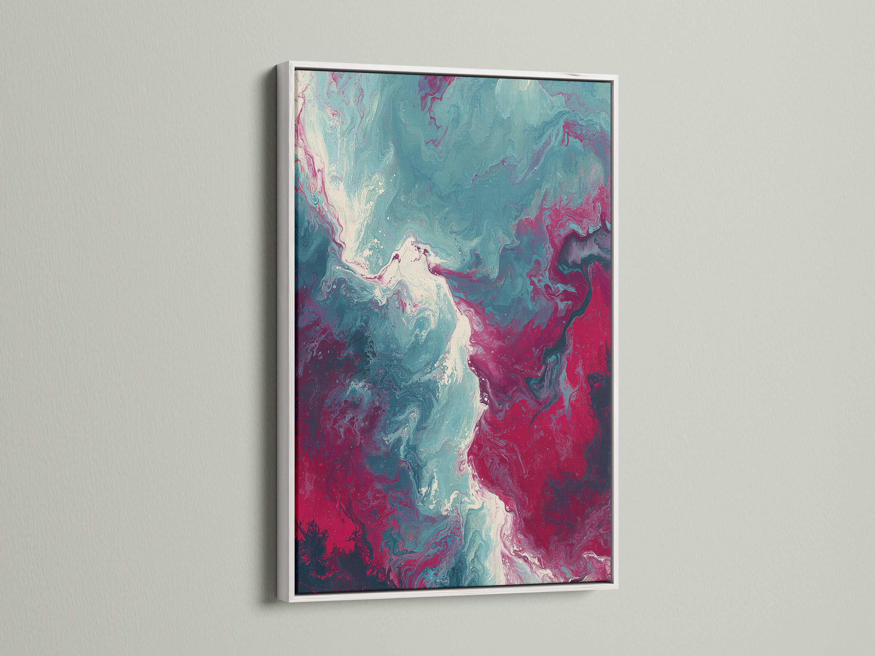 An abstract fluid art print is elegantly framed in white. The contemporary artwork features a stunning marble swirl pattern in teal and pink. The white frame adds a clean and modern touch. This piece is ideal for enhancing bedroom wall decor or adding a splash of color to any living space.