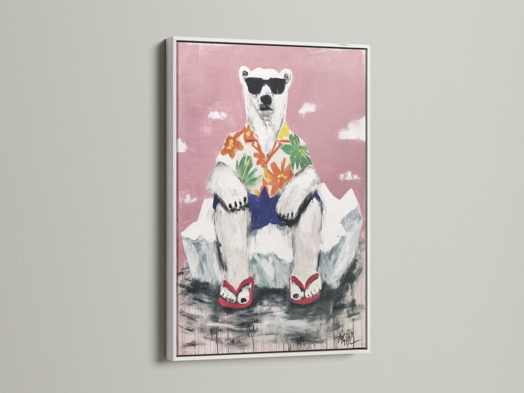 A cool polar bear canvas in a white frame. This tropical wall art is perfect for a nursery. The funny animal print brings playful art to your home. This bear artwork adds a whimsical touch.