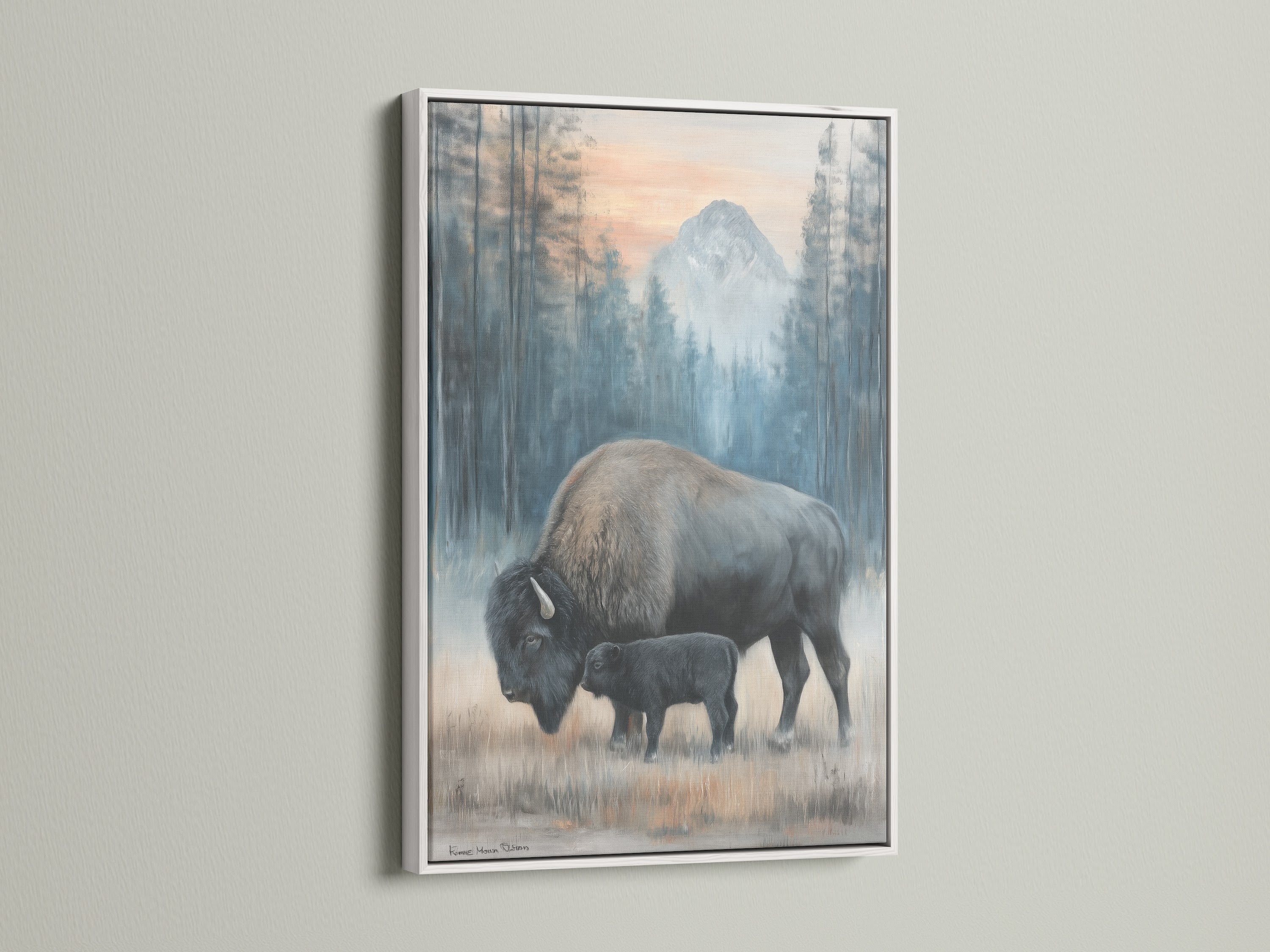 This wildlife canvas features a bison mother and calf in a white frame. Ideal for adding a serene touch to your home. This animal wall art complements any interior style. Consider it for rustic decor.
