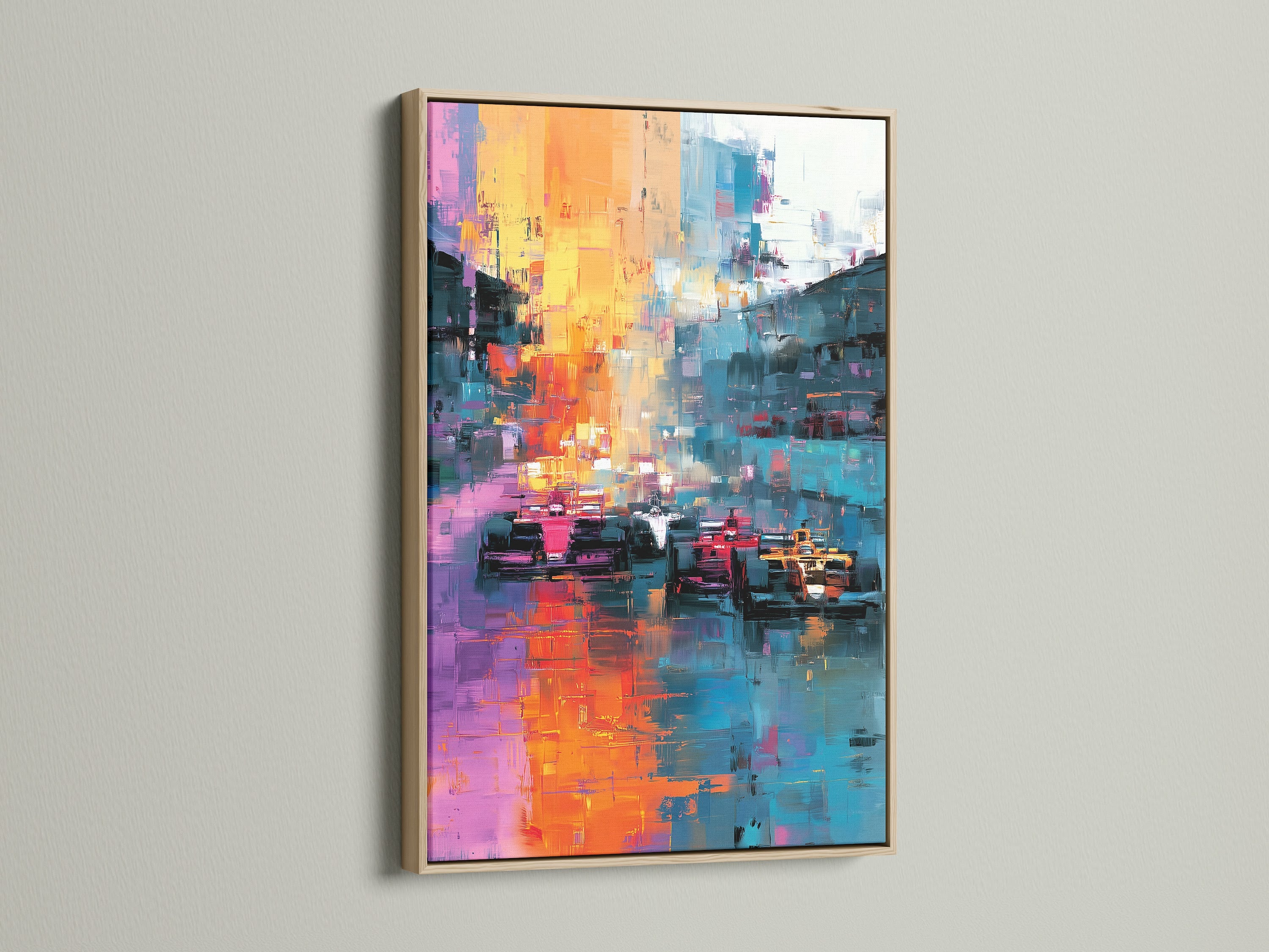 This image displays an abstract artwork with race cars framed in oak. The art is mounted on a clean white wall. The art piece adds a touch of sophistication to any room. The oak frame enhances the artwork's colors.