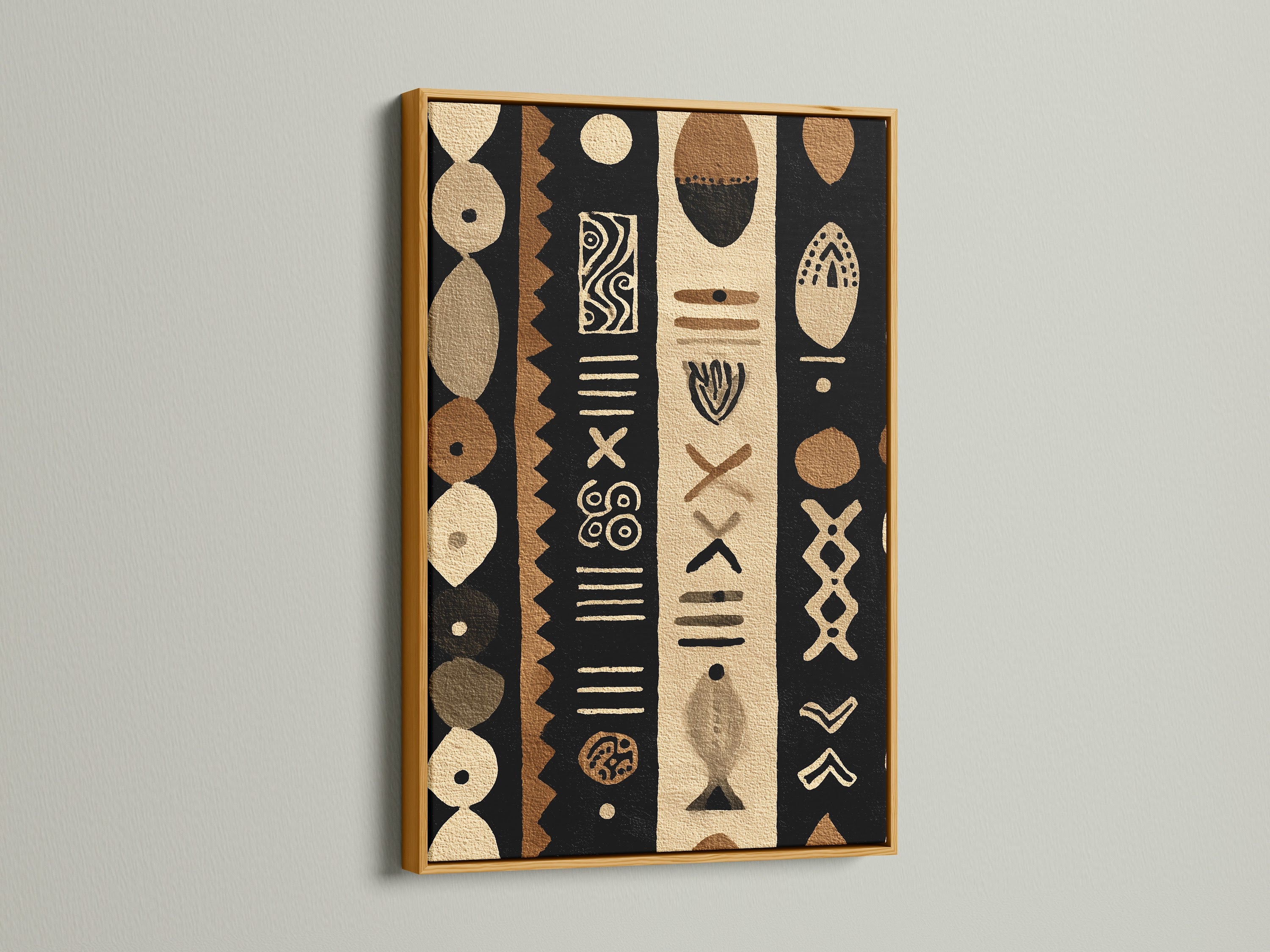 A luxurious gold frame elevates a tribal artwork. The artwork is composed of black brown and beige tones. The metallic sheen of the gold frame catches the light. It adds a touch of opulence to any interior decor.