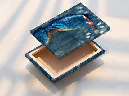 This is a stretched canvas print of the kingfisher. The bird canvas is ready to hang. The wildlife print is ideal for any room. The modern decor adds a touch of nature indoors. It is a beautiful piece