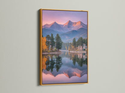 Enhance your decor with this mountain lake canvas. The gold frame adds a touch of elegance to the serene landscape. The sunset mountains create a calming atmosphere. Perfect as a nature photography piece for any room.