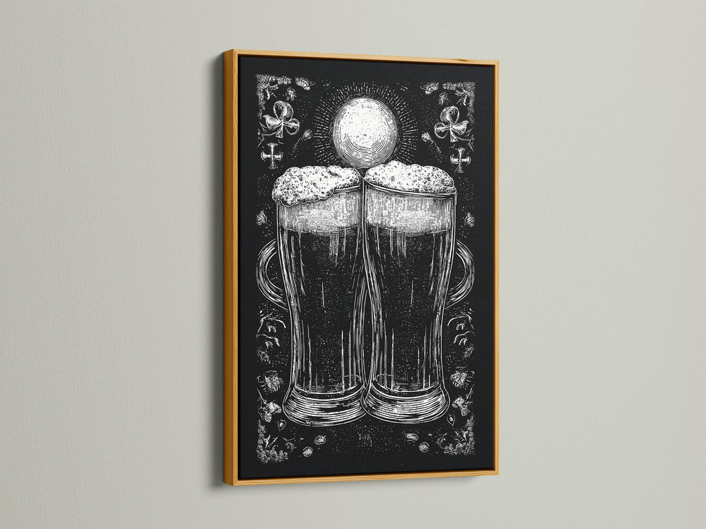 A framed artwork is on display. The art is in a gold frame. The artwork features a monochromatic illustration of two beer glasses. The beer glasses are the focal point. The print adds a touch of elegance to any room. The gold frame brings a touch of luxury.