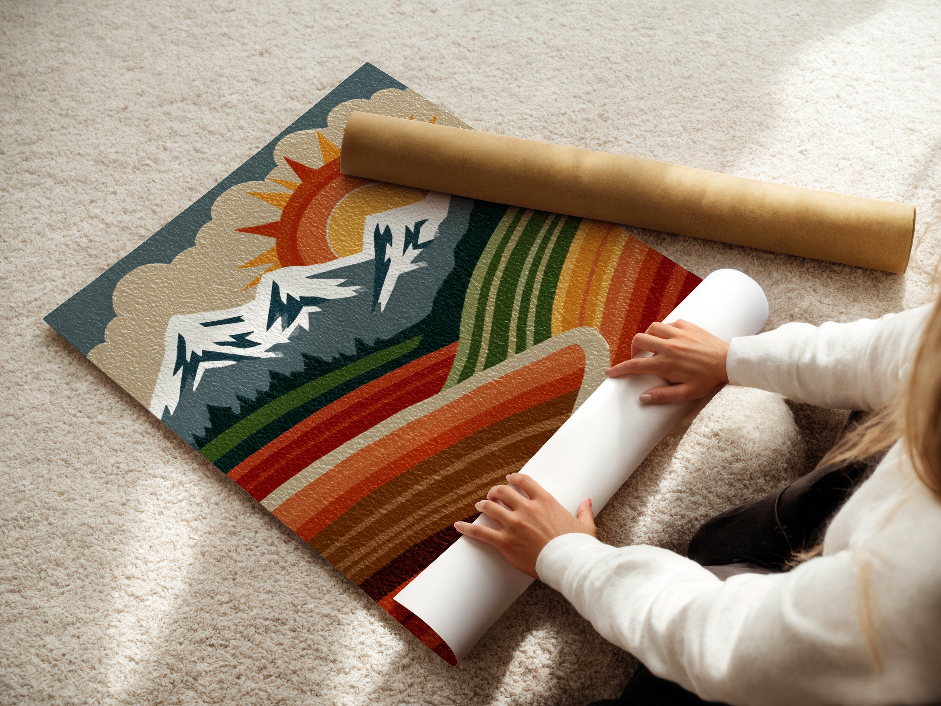 A woman carefully rolls a fine art poster paper print. The artwork displays a retro mountain landscape with a sun mountains and valley. The fine art poster option allows for a versatile and affordable art solution for any space.