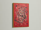 Vibrant abstract splatter art print displayed on a red canvas. The artwork is showcased in a luxurious gold frame. Modern paint drip techniques enhance its contemporary appeal. This bold red art adds sophistication to any interior. Perfect for those seeking expressive modern artwork.