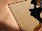 A close-up of the canvas print in a floating frame. The woman silhouette artwork features flowing hair. This bohemian figure art is perfect for a bedroom. The floating frame adds a modern touch. It enhances the artwork's visual appeal. This artwork is ideal for minimalist and contemporary settings.