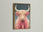 Gold frame showcasing a pink Highland Cow. This fluffy cattle art is a statement piece. This animal canvas art elevates your decor. Bring home this Scottish cow decor today. Perfect for any room.
