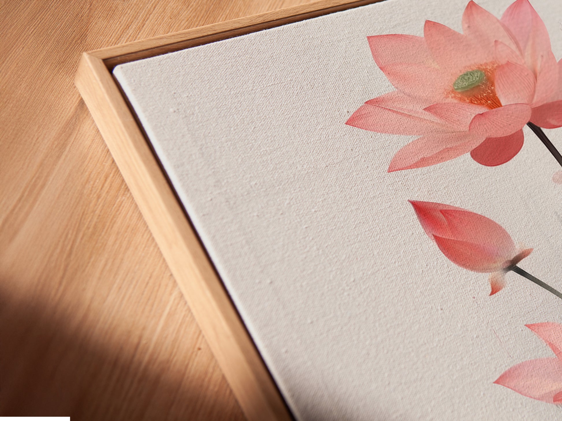 A close-up view of a canvas print in a floating frame. This framing style gives the lotus flower art a modern look. Perfect for showcasing floral canvas prints. The floating frame enhances the botanical print's contemporary appeal. Ideal for modern wall art and home decoration.