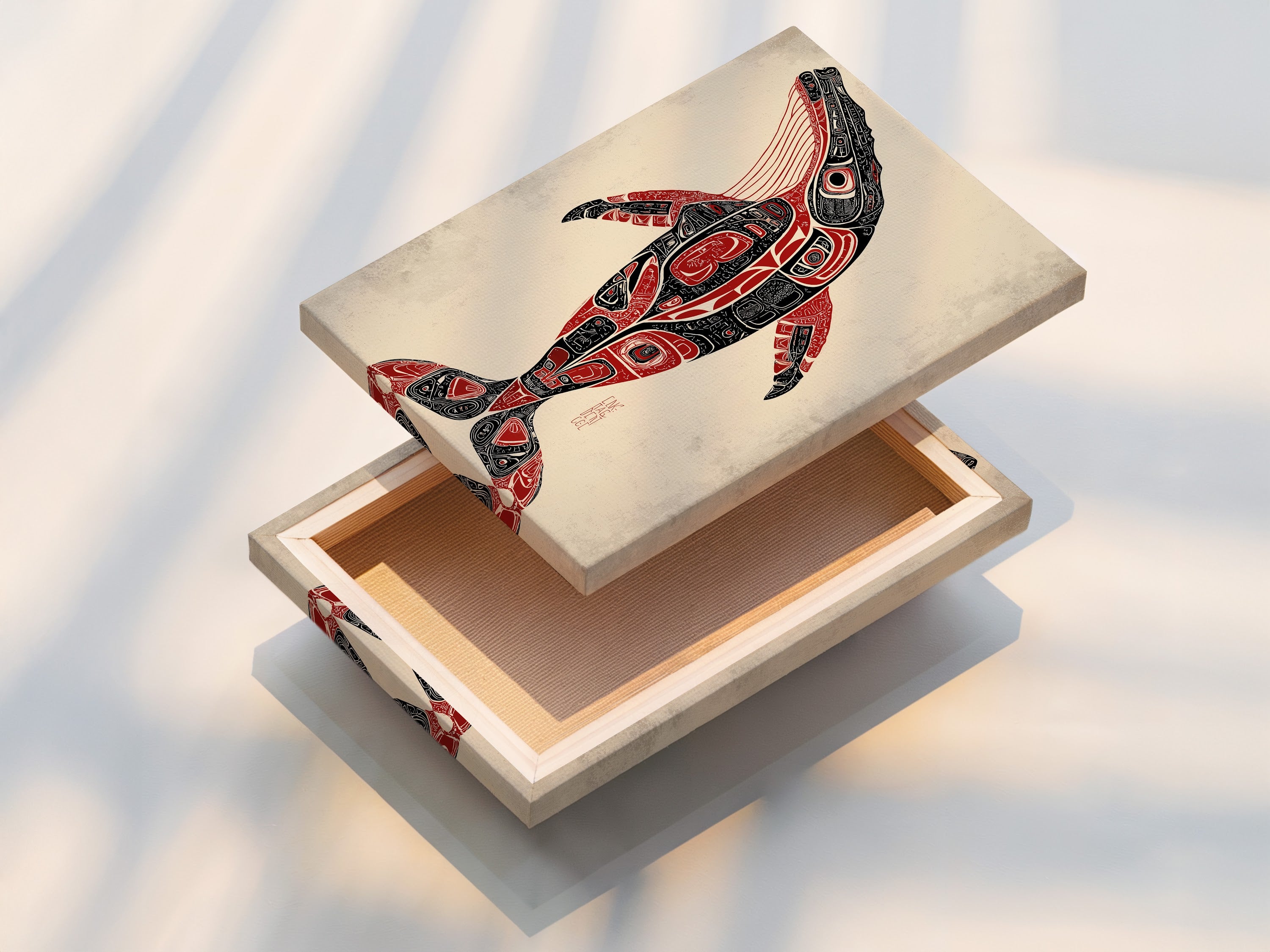 A stretched canvas print of whale art is displayed. This Pacific Northwest native artwork is ready to hang. The tribal wall art adds texture and depth. A stunning office addition.